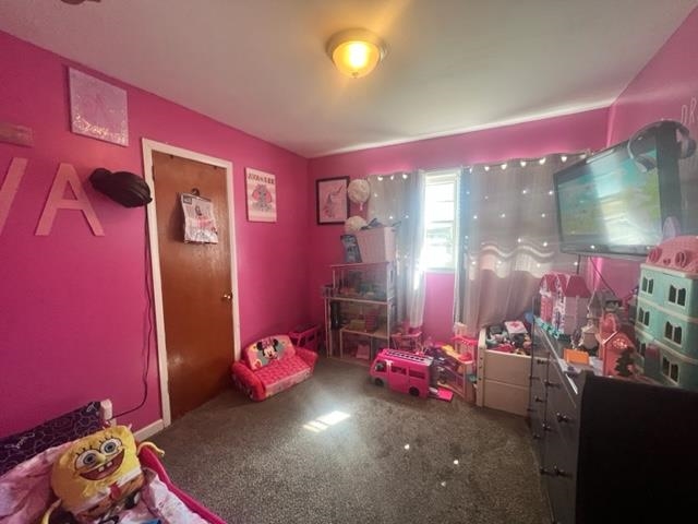 4606 Macon Road Memphis, TN 38122 - Photo 6 of 12 a bedroom with furniture and a lamp