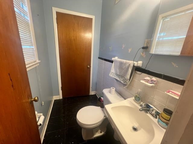 4606 Macon Road Memphis, TN 38122 - Photo 8 of 12 a bathroom with a sink and mirror with toilet