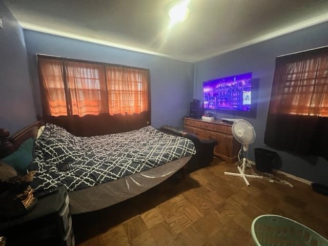 4606 Macon Road Memphis, TN 38122 - Photo 10 of 12 a bedroom with a bed dresser and a window