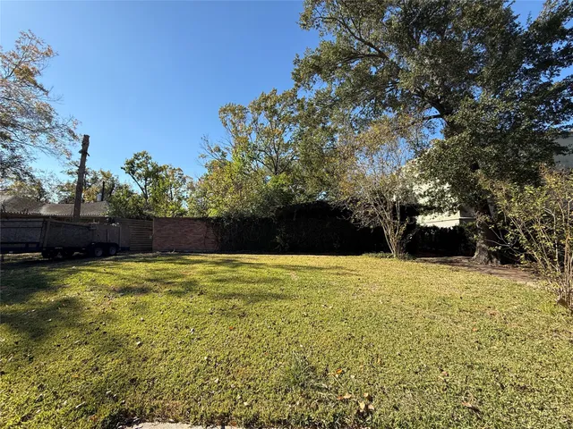 a view of a pool with a yard
