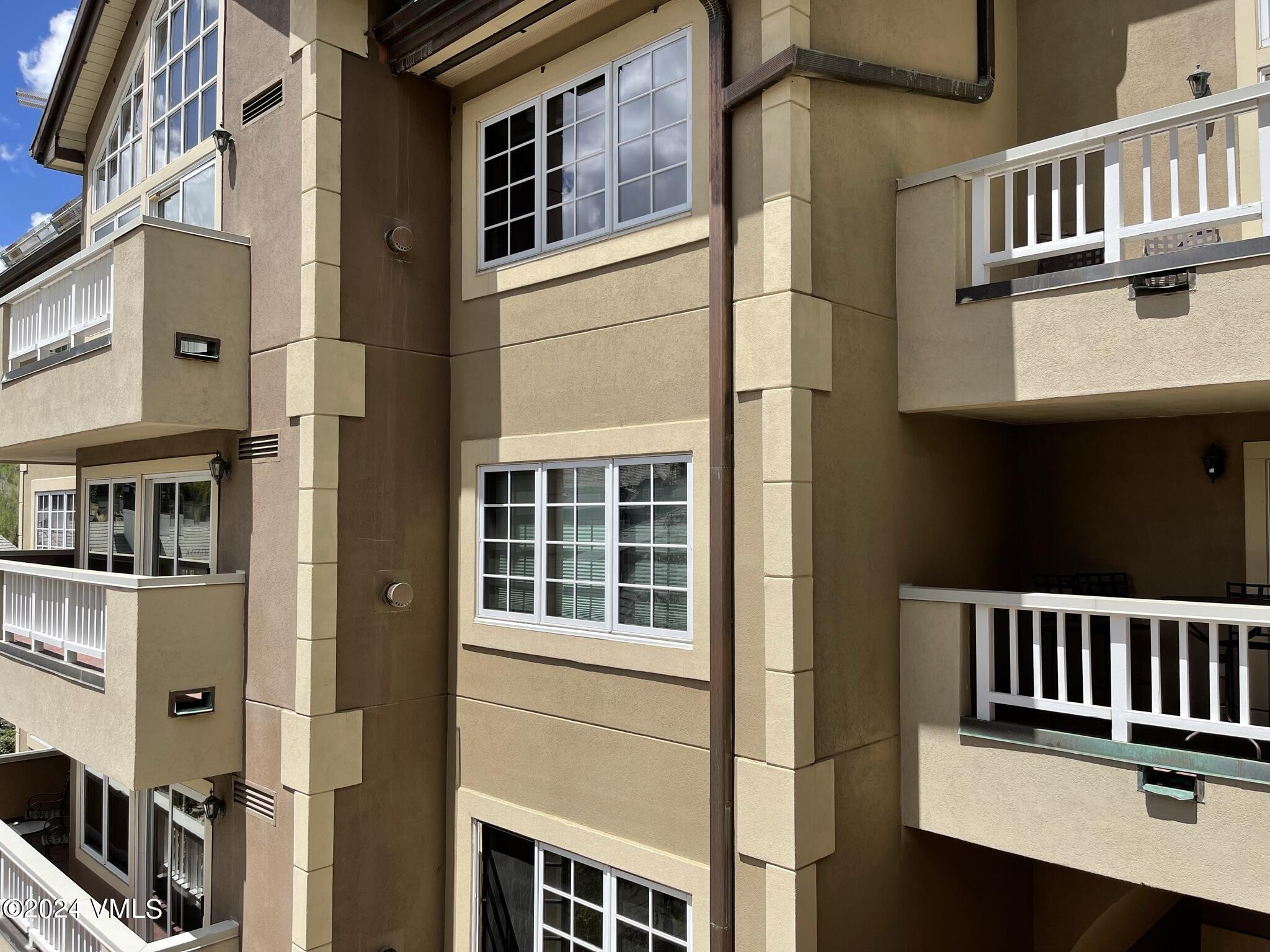210 Offerson Road, Unit R215 WEEKS 13 & 14 Beaver Creek, CO 81620 - Photo 7 of 32 a view of a brick house with many windows