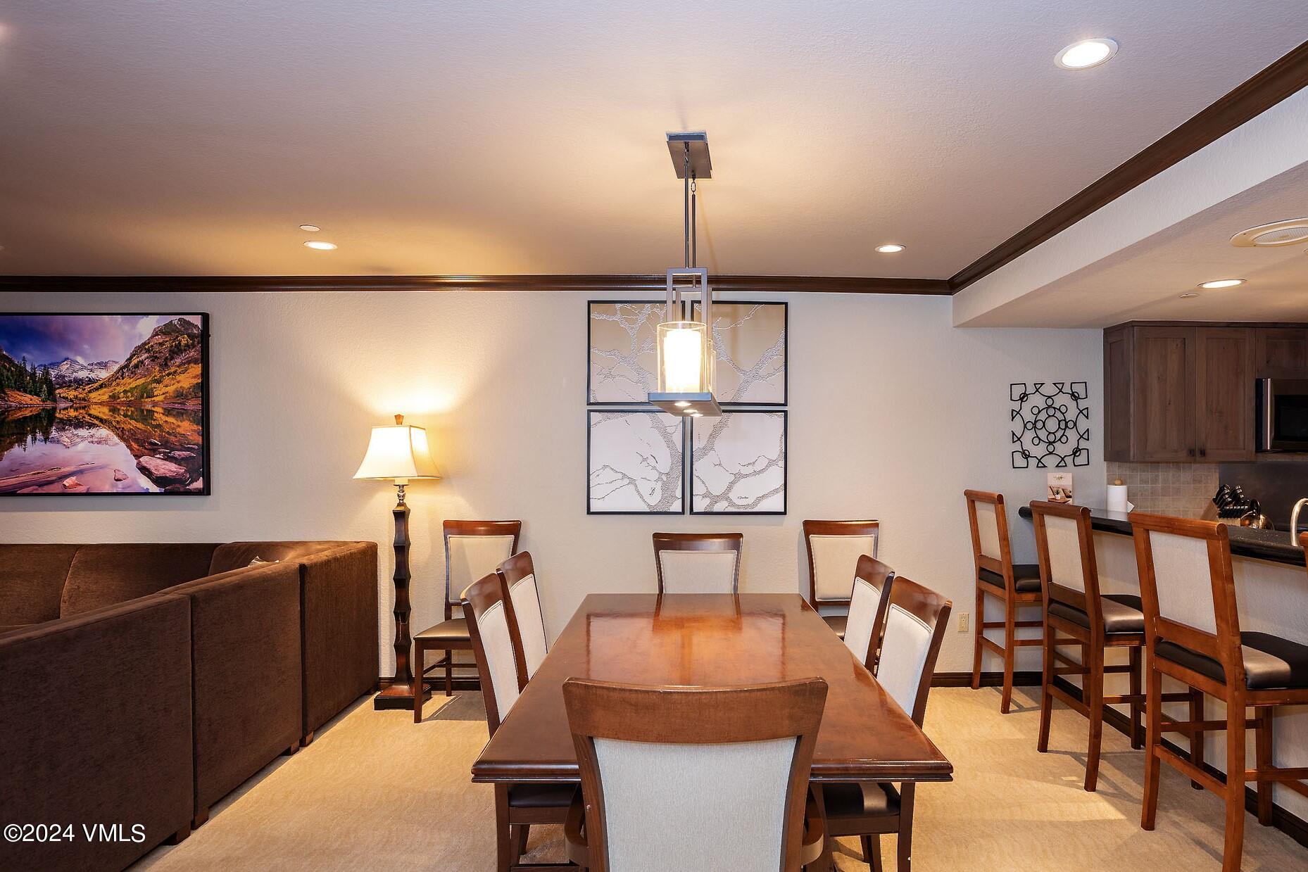 210 Offerson Road, Unit R215 WEEKS 13 & 14 Beaver Creek, CO 81620 - Photo 9 of 32 a dining room with furniture and window