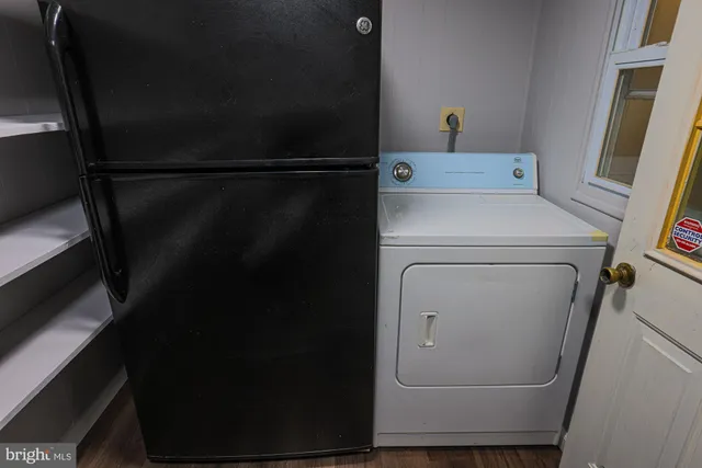 a utility room with dryer and washer