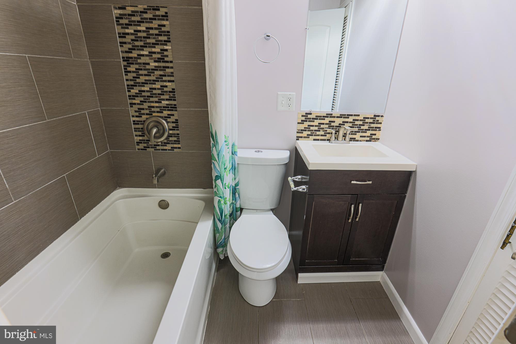 2507 Taney Road Baltimore, MD 21209 - Photo 27 of 58 a bathroom with a toilet and a shower