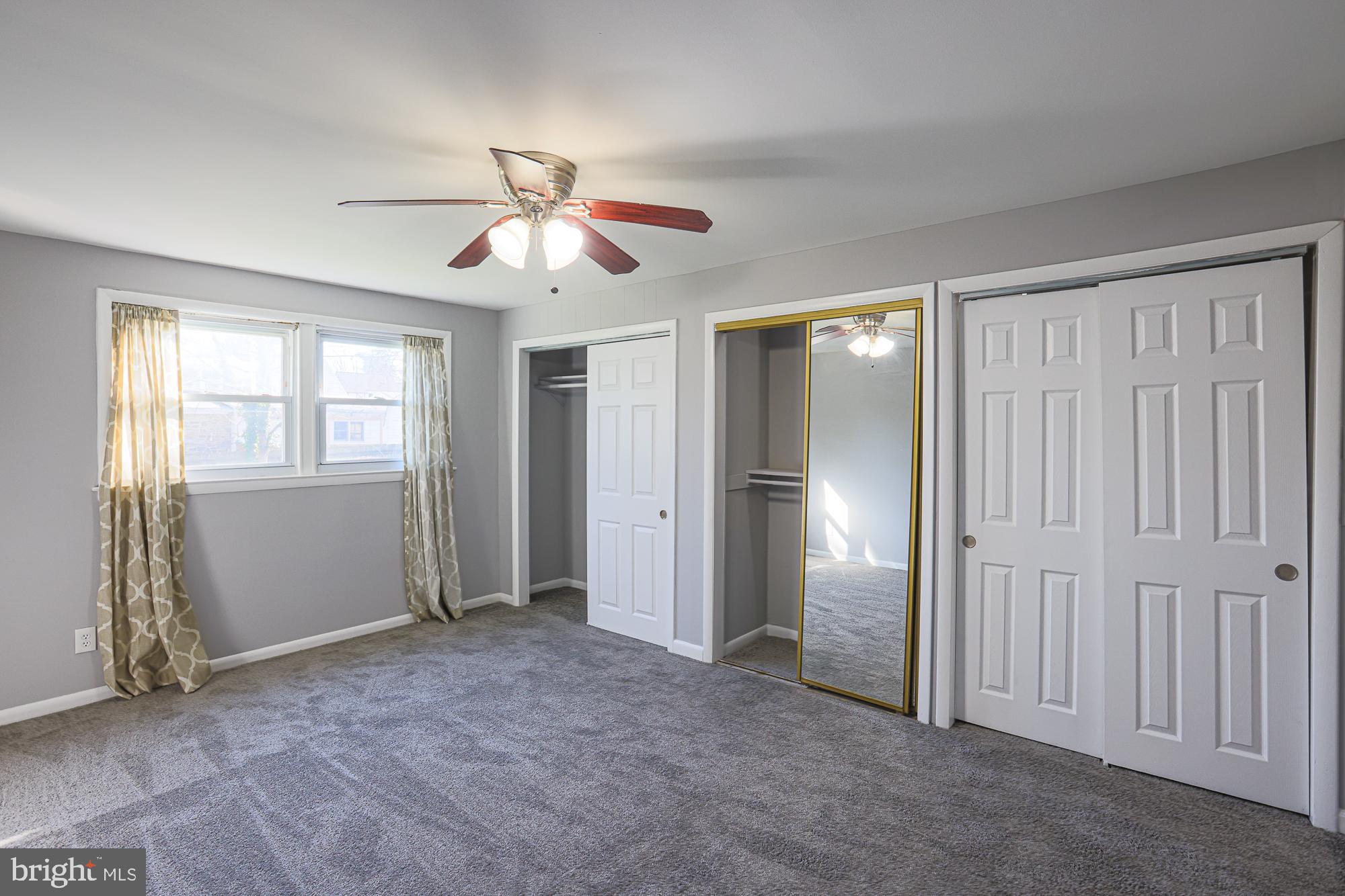 2507 Taney Road Baltimore, MD 21209 - Photo 30 of 58 a view of empty room with window and ceiling fan