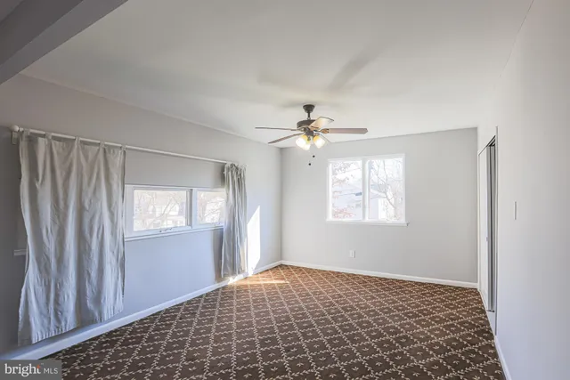 a view of an empty room and window