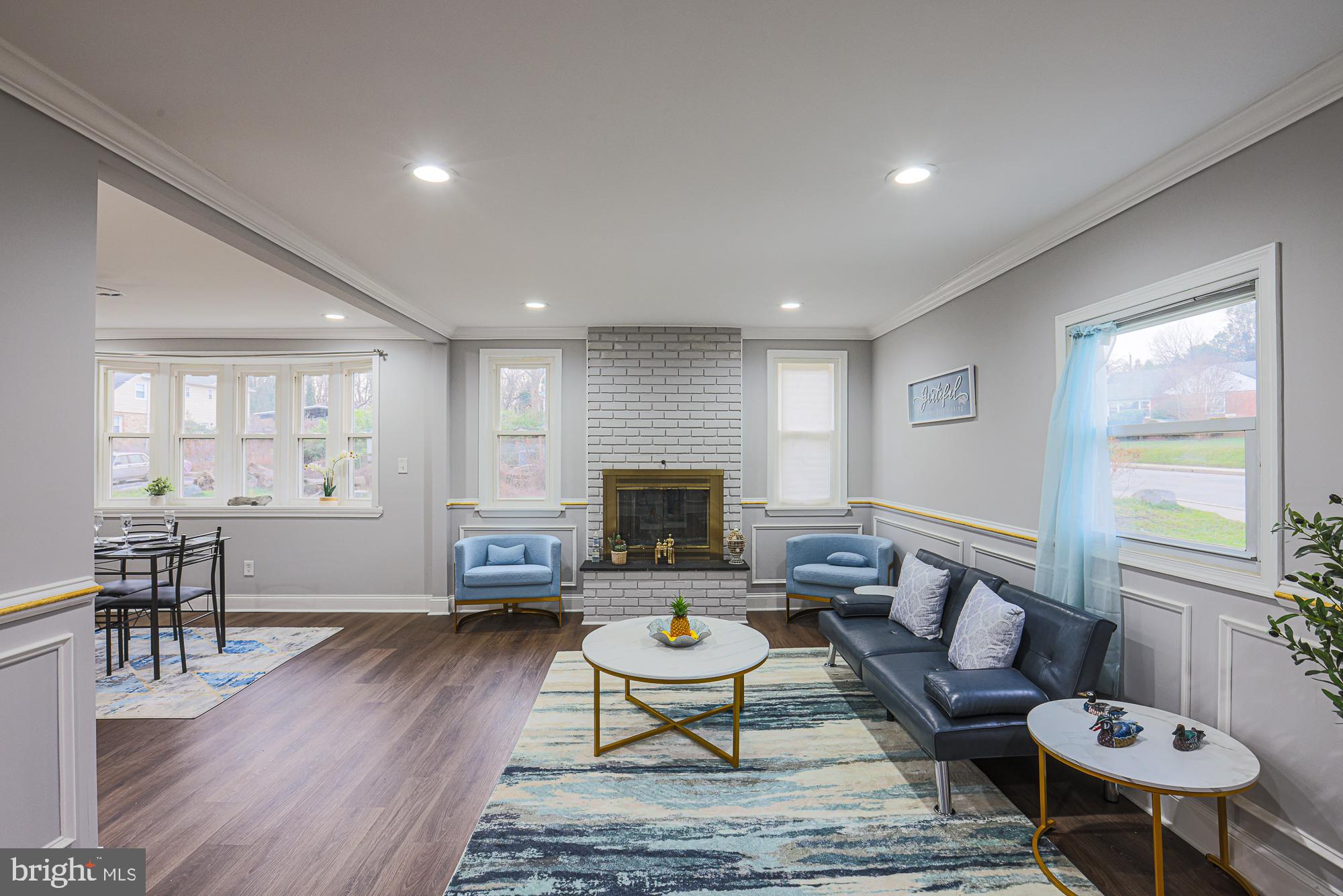 2507 Taney Road Baltimore, MD 21209 - Photo 37 of 58 a living room with furniture and a wooden floor