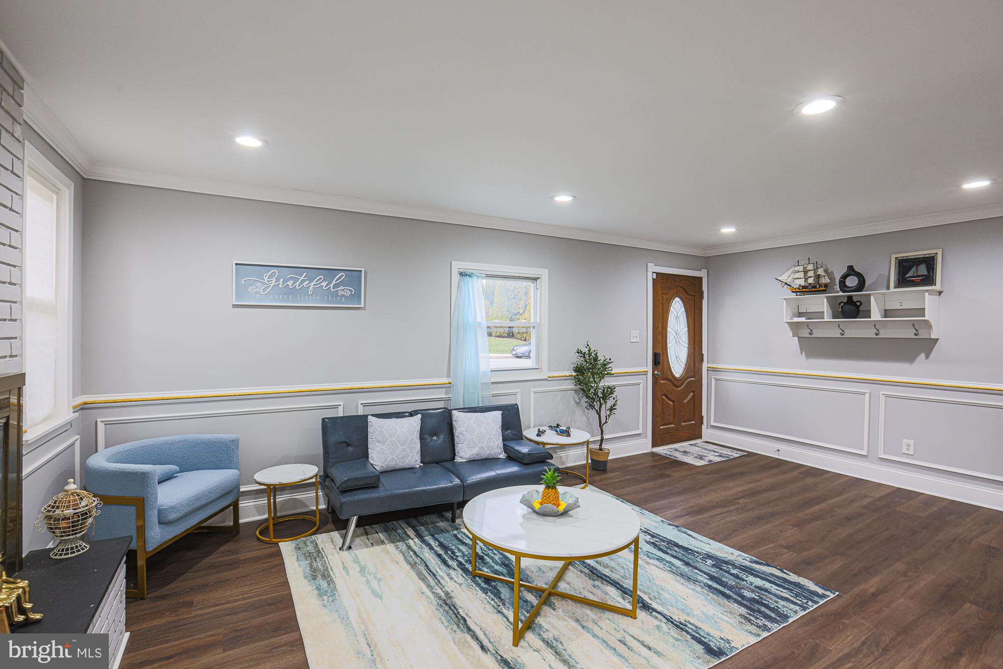 2507 Taney Road Baltimore, MD 21209 - Photo 39 of 58 a living room with furniture and a wooden floor