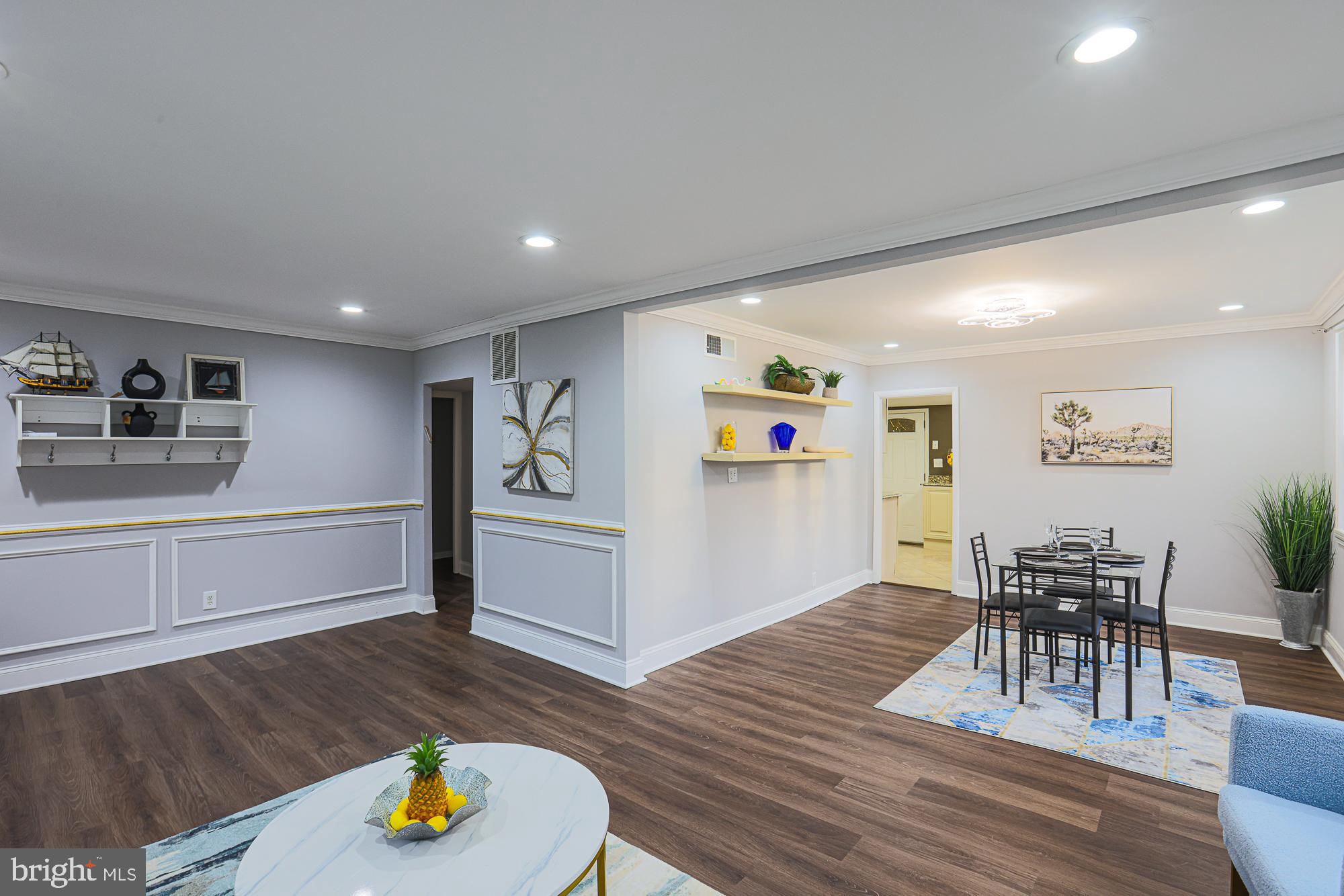 2507 Taney Road Baltimore, MD 21209 - Photo 40 of 58 a view of kitchen and dining room with wooden floor