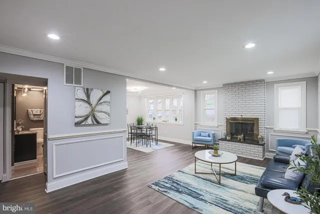 a living room with furniture or couch and a fireplace