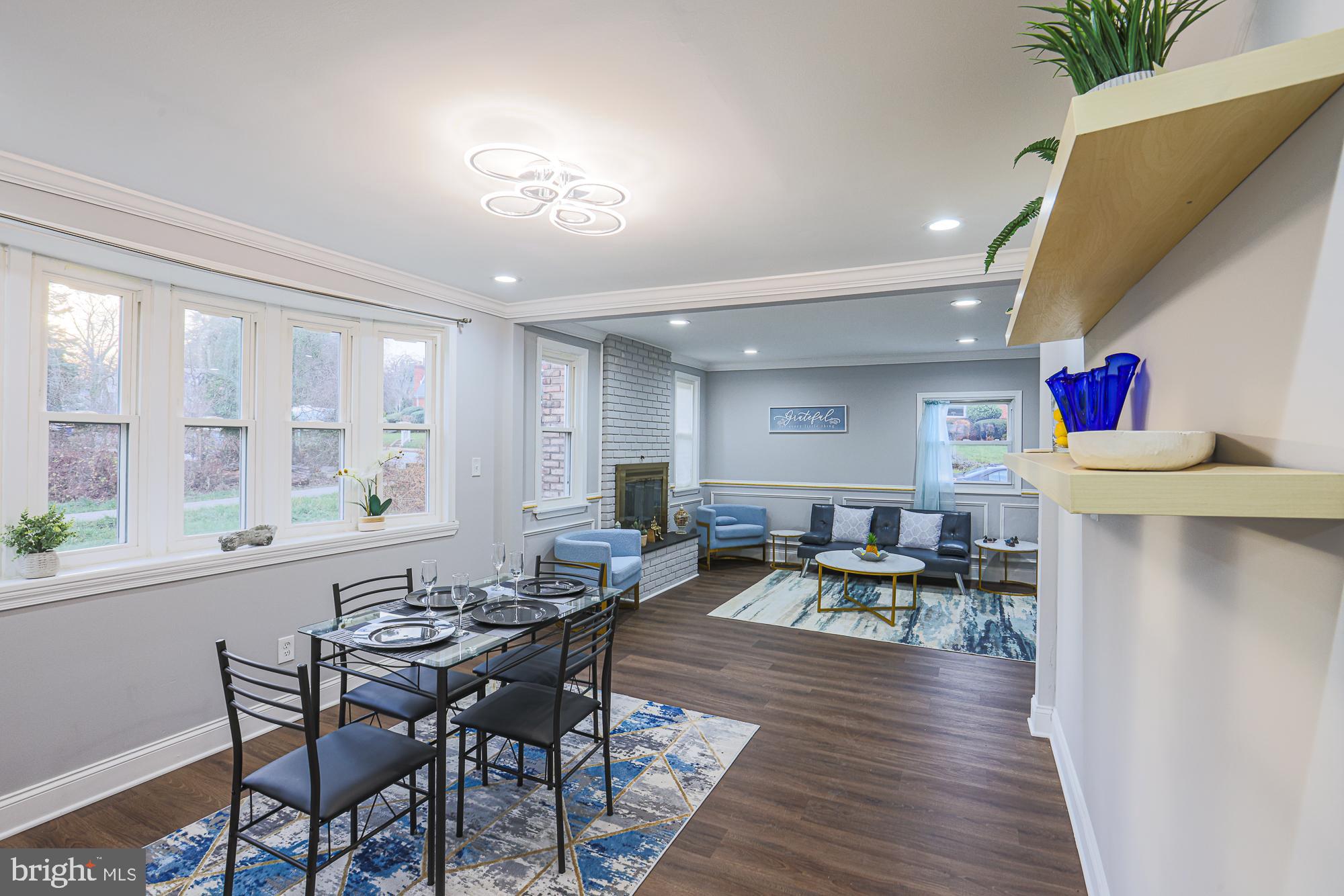 2507 Taney Road Baltimore, MD 21209 - Photo 42 of 58 a view of a dining room with furniture and wooden floor