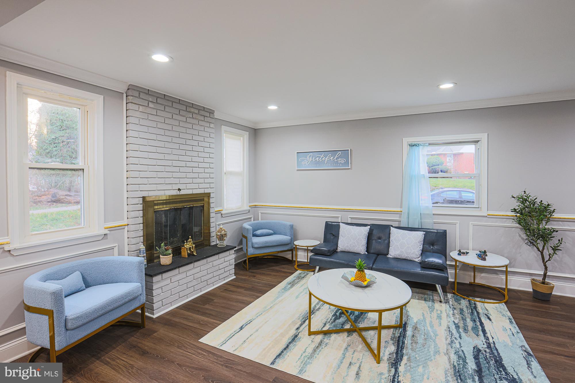 2507 Taney Road Baltimore, MD 21209 - Photo 44 of 58 a living room with furniture and a fireplace