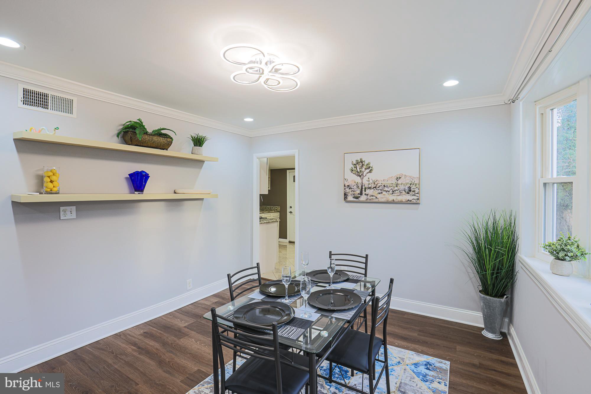 2507 Taney Road Baltimore, MD 21209 - Photo 45 of 58 a room with furniture and wooden floor