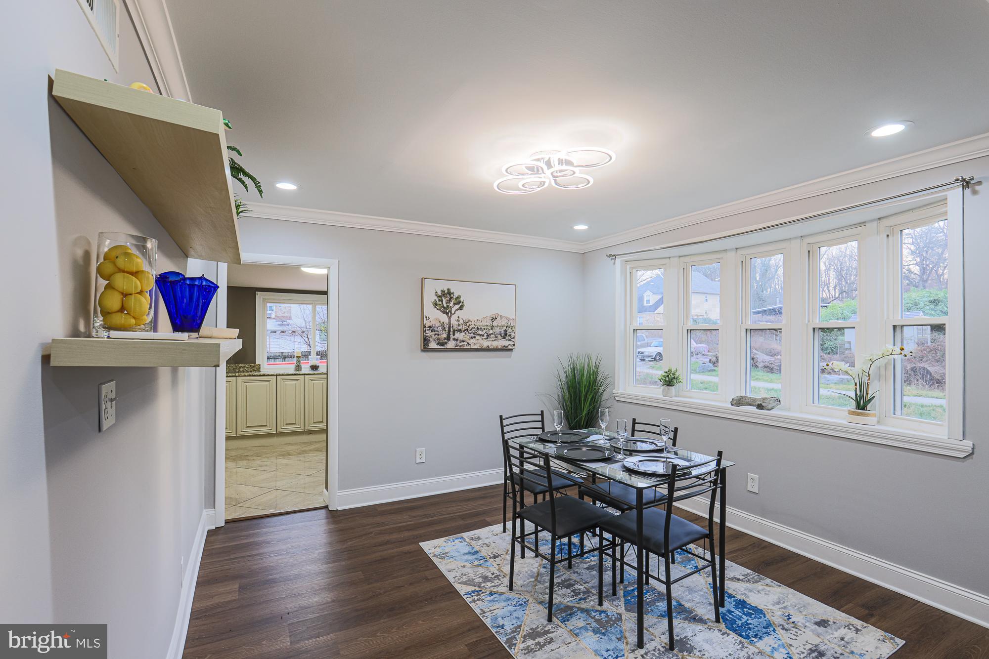 2507 Taney Road Baltimore, MD 21209 - Photo 46 of 58 a view of a dining room with furniture window and wooden floor