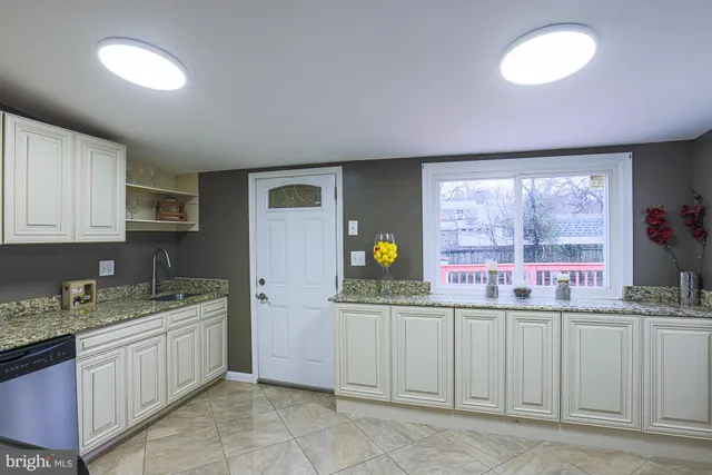 a kitchen with a sink and cabinets