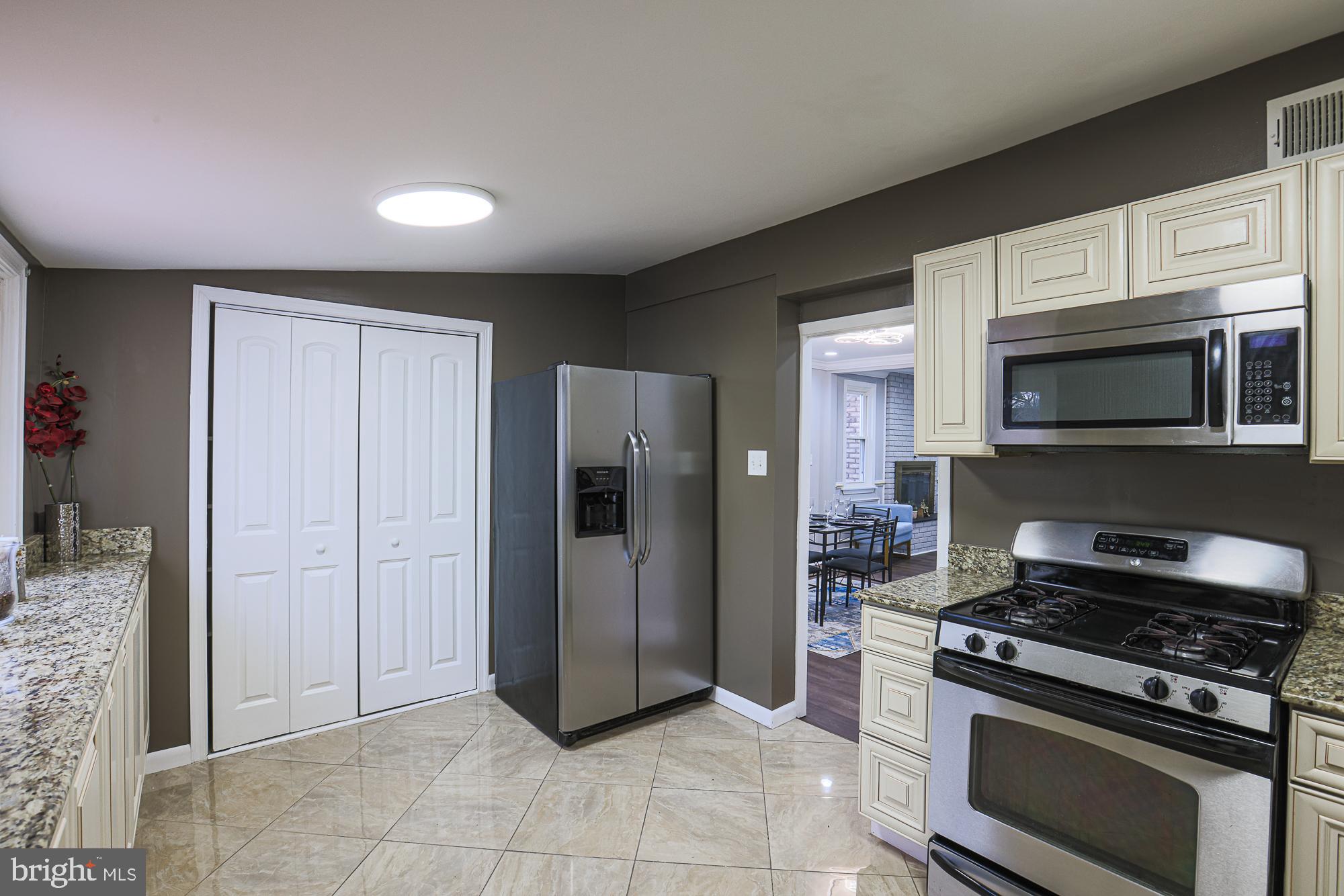 2507 Taney Road Baltimore, MD 21209 - Photo 53 of 58 a kitchen with stainless steel appliances granite countertop a refrigerator and a stove top oven