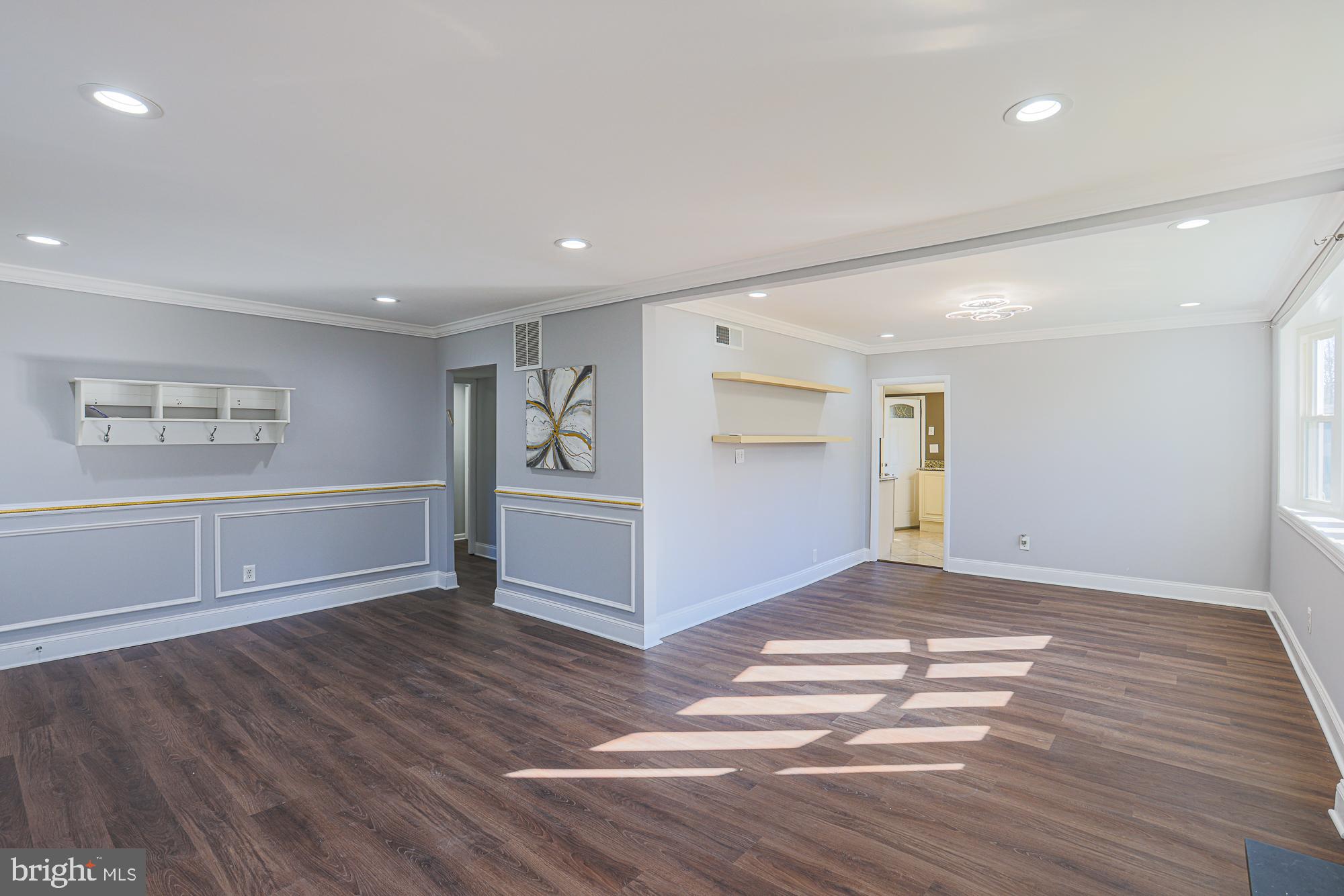 2507 Taney Road Baltimore, MD 21209 - Photo 8 of 58 a view of empty room with wooden floor