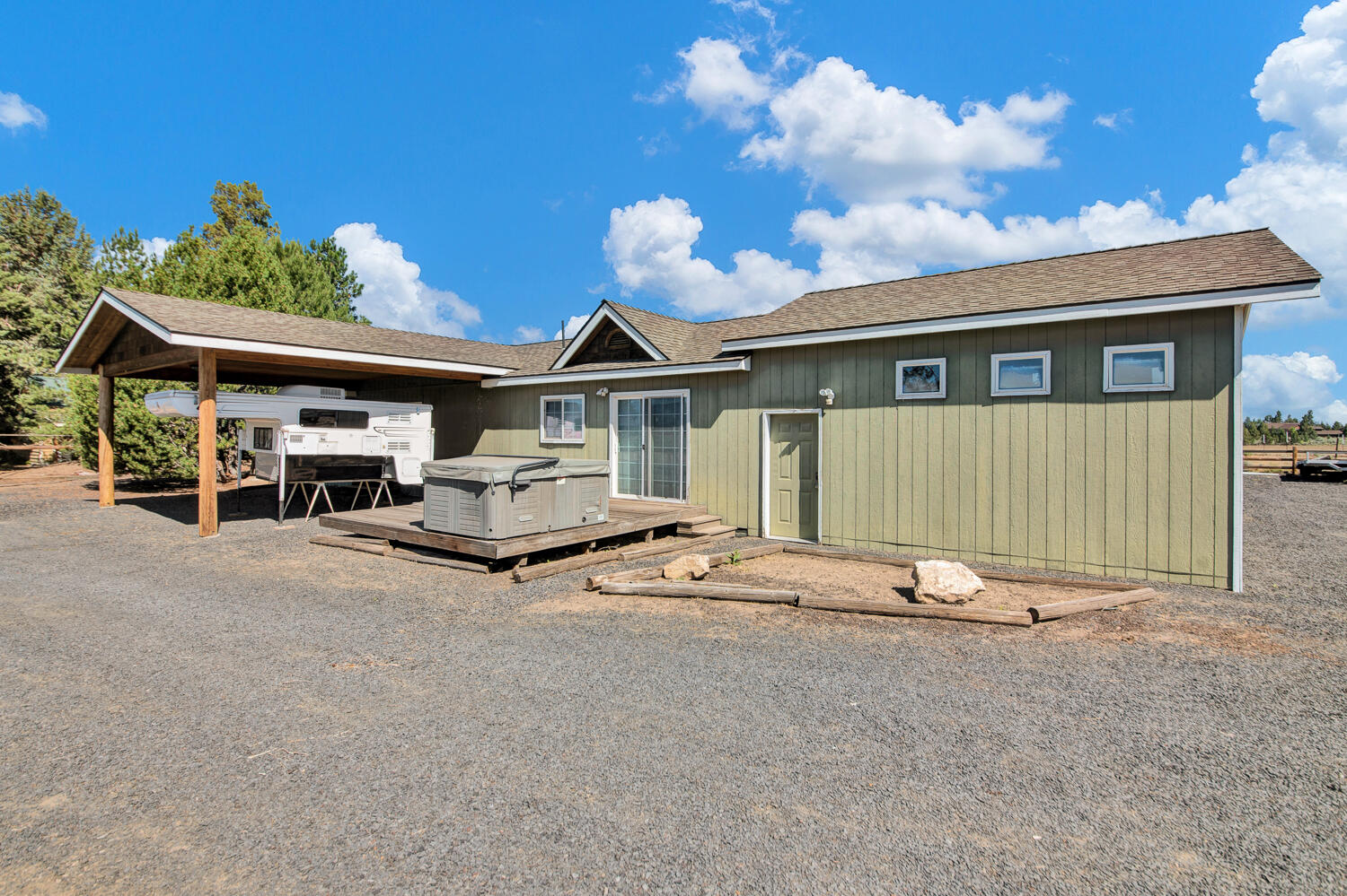 67100 Fryrear Road Bend, OR 97703 - Photo 25 of 38 a front view of a house with a garden and trees