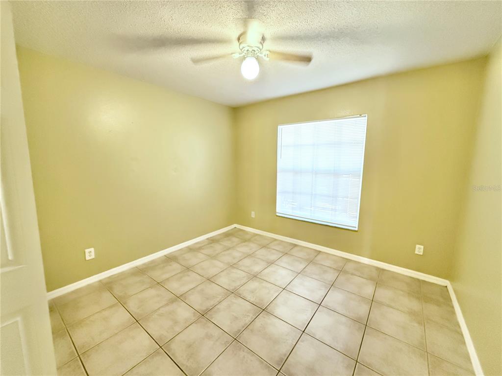 4695 Prairie Point Boulevard Kissimmee, FL 34746 - Photo 17 of 27 a view of an empty room with a window