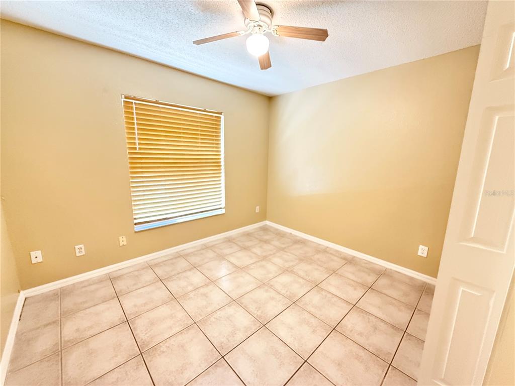 4695 Prairie Point Boulevard Kissimmee, FL 34746 - Photo 21 of 27 a view of an empty room with a window