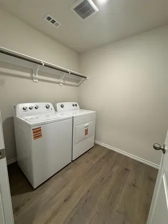 an empty room with a empty space and windows