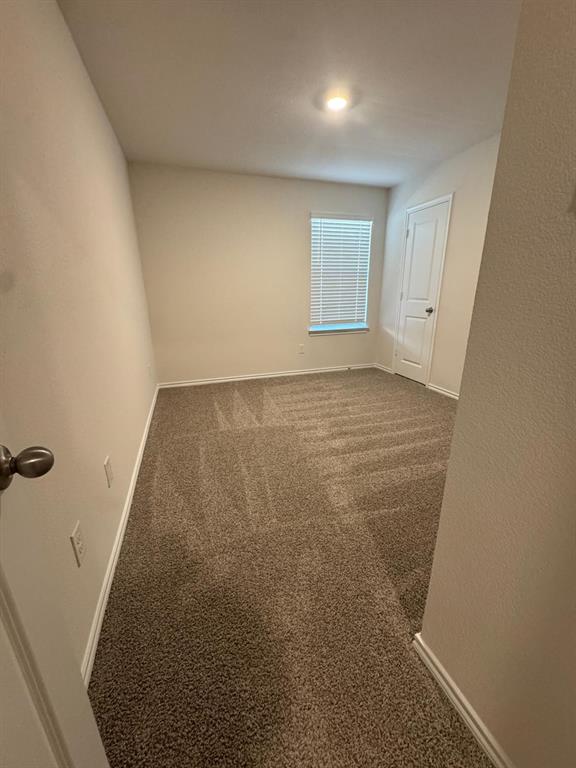 3905 Turquoise Avenue Celina, TX 75009 - Photo 8 of 19 an empty room with a workbench