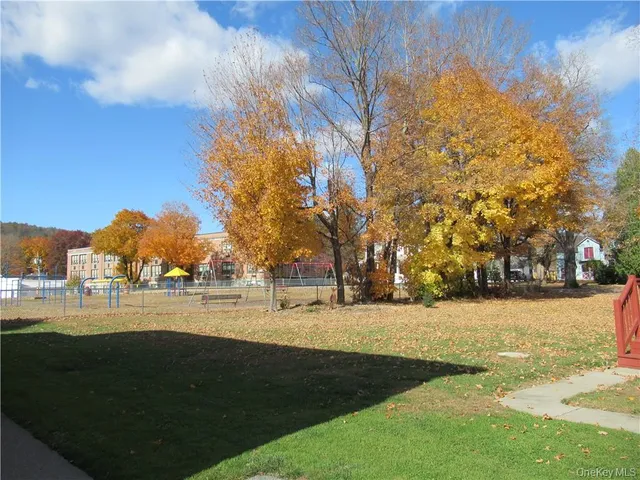 a view of outdoor space with garden and trees
