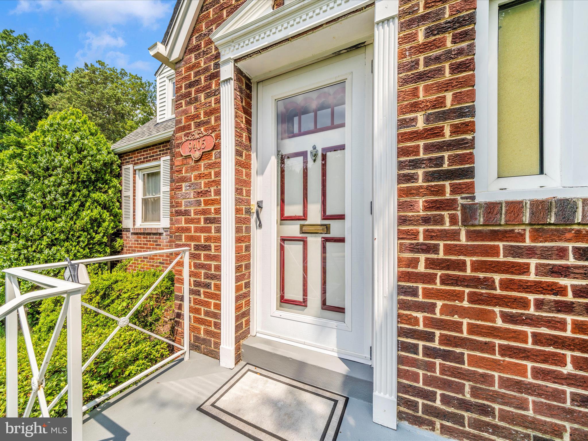 9405 Flower Avenue Silver Spring, MD 20901 - Photo 2 of 51 a view of front door of house with wooden floor and windows