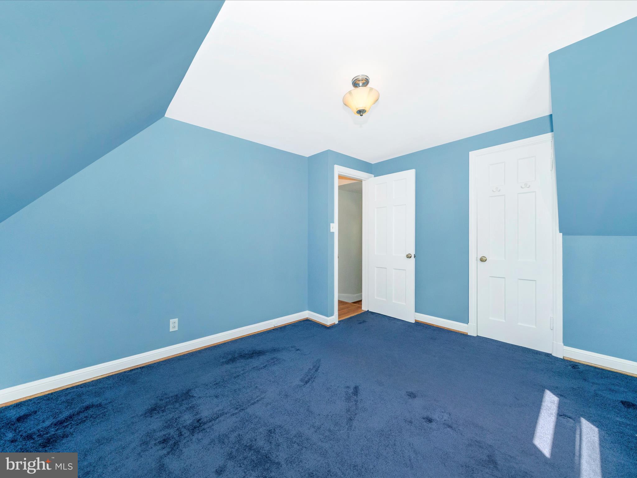 9405 Flower Avenue Silver Spring, MD 20901 - Photo 30 of 51 an empty room with wooden floor