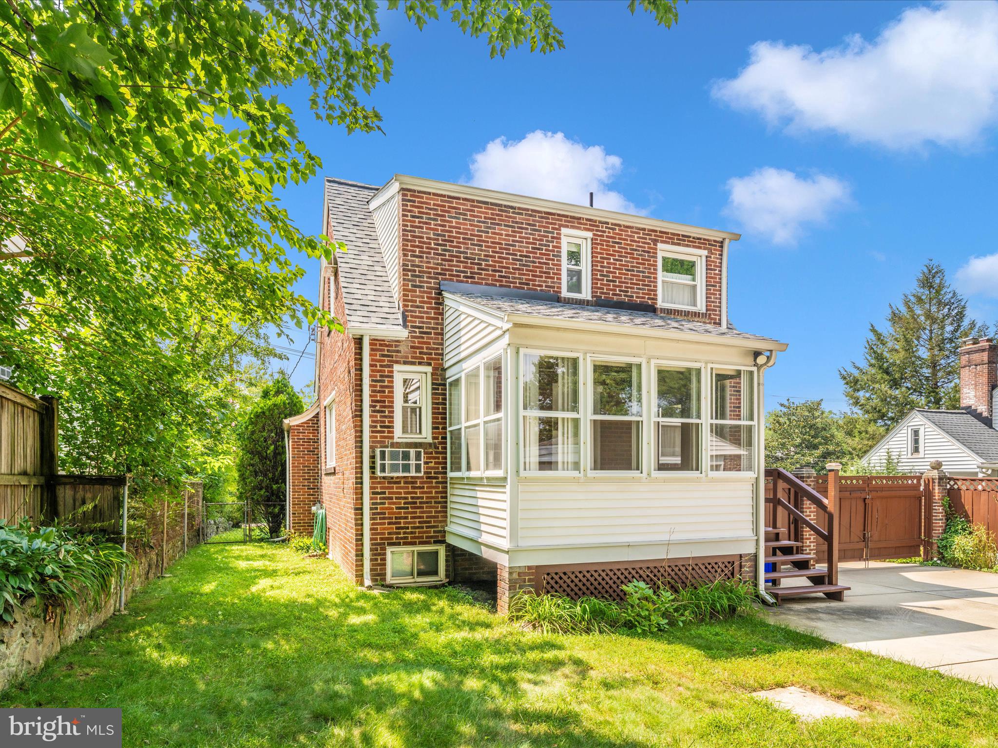 9405 Flower Avenue Silver Spring, MD 20901 - Photo 40 of 51 a view of a house with yard and sitting area