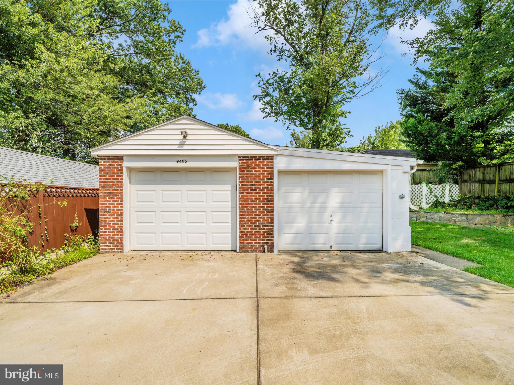 9405 Flower Avenue Silver Spring, MD 20901 - Photo 43 of 51 a front view of a house with a garage