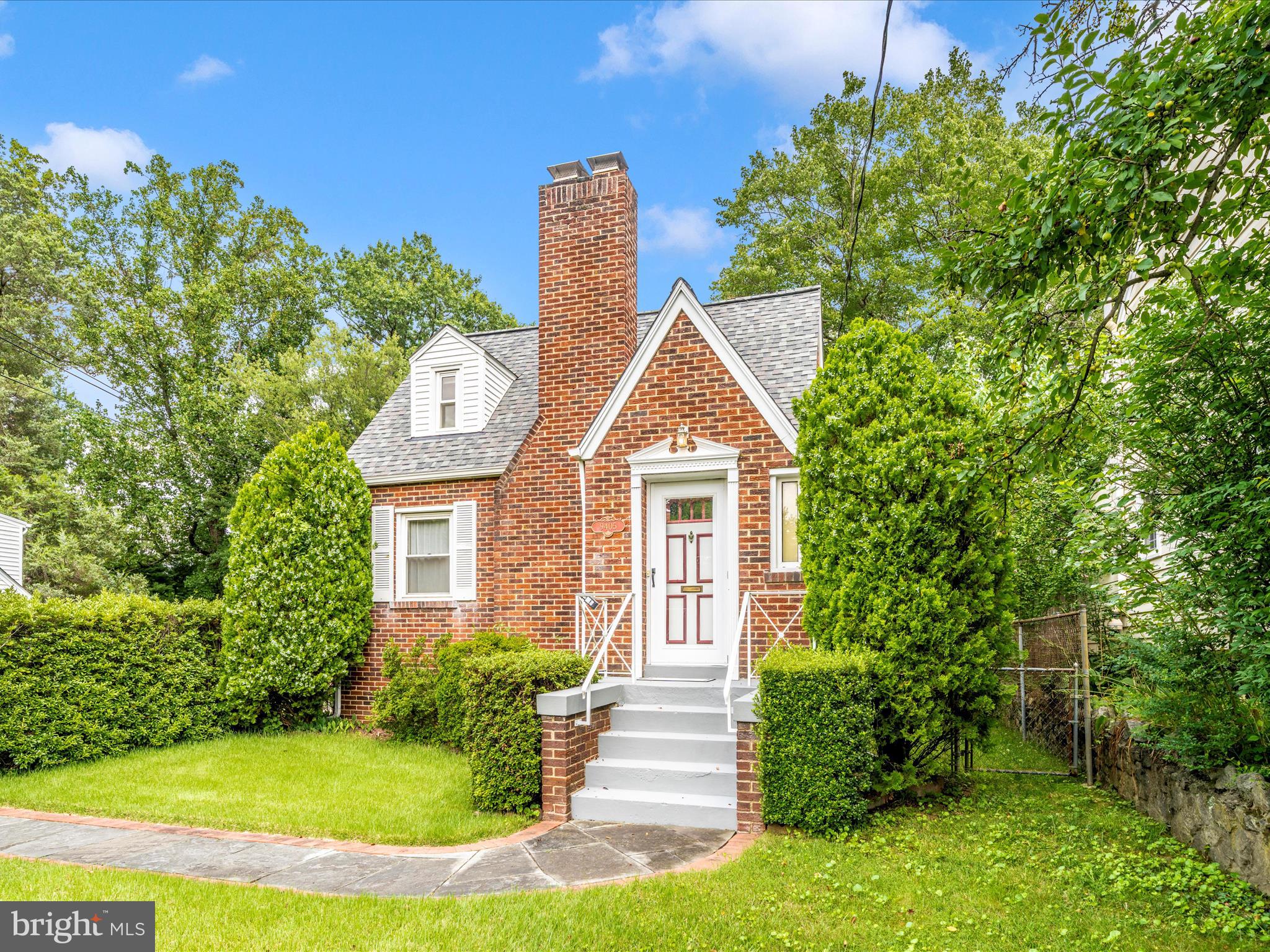 9405 Flower Avenue Silver Spring, MD 20901 - Photo 49 of 51 a front view of a house with a yard
