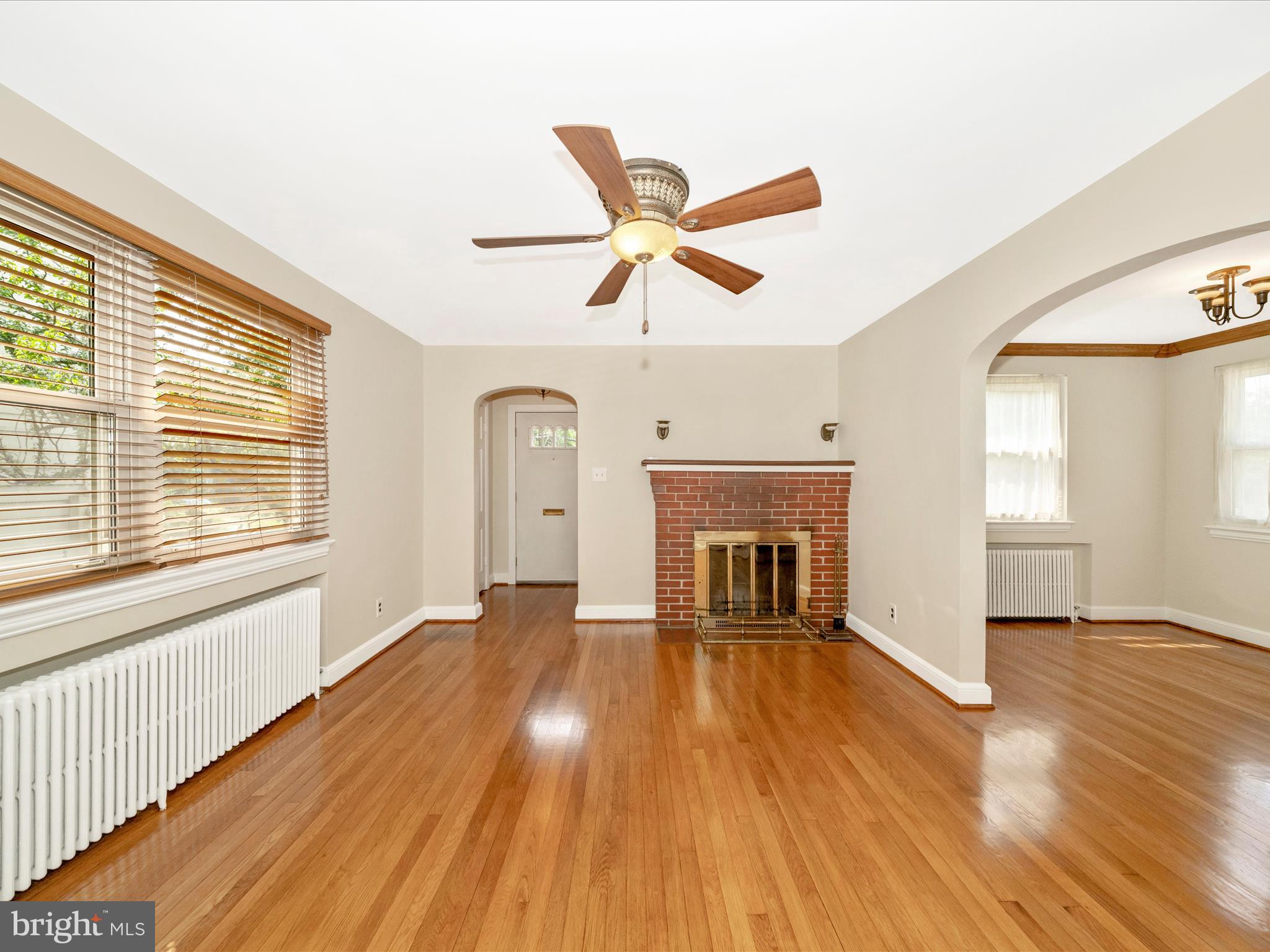 9405 Flower Avenue Silver Spring, MD 20901 - Photo 8 of 51 a view of empty room with wooden floor and fan