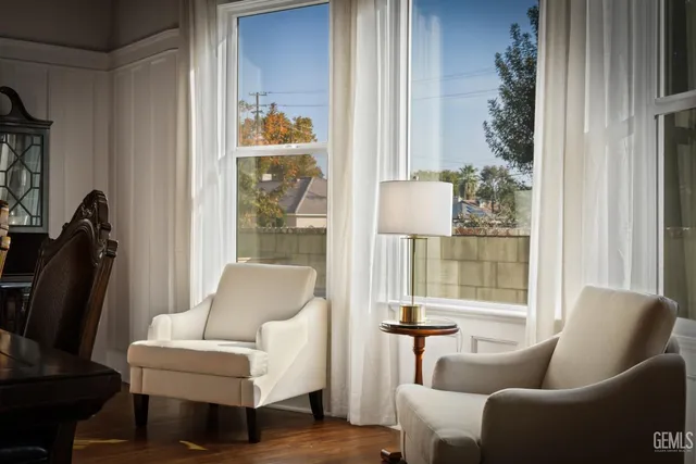 a view of a dining room with furniture wooden floor and chandelier