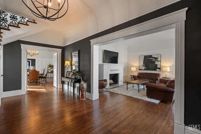 a view of a livingroom with furniture and bookshelf