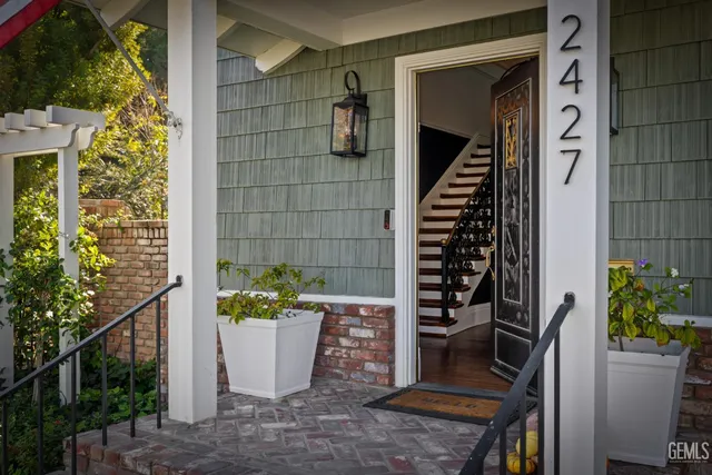 a living room with furniture fireplace and flat screen tv