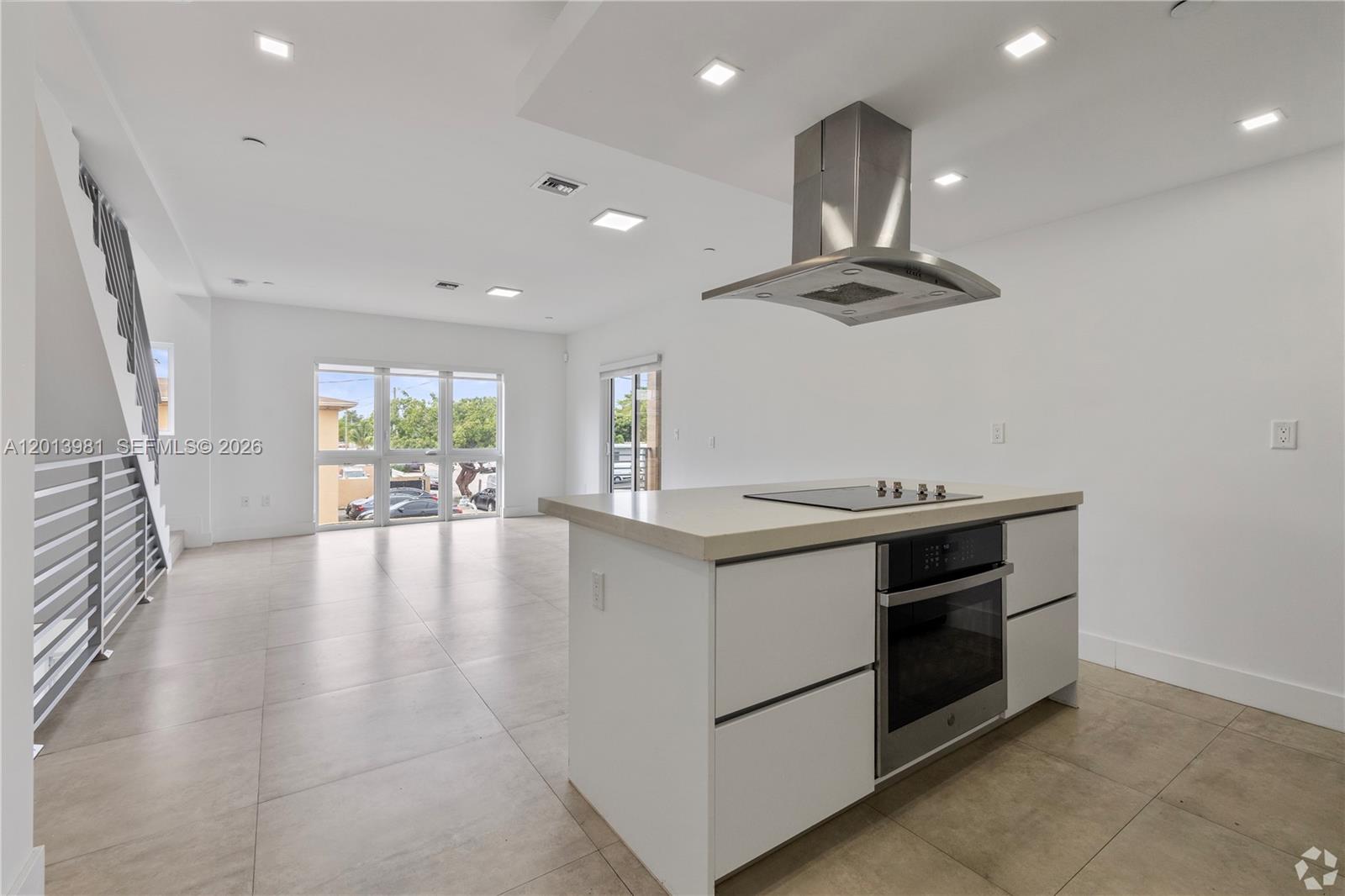 434 Southwest 10th Street, Unit A Miami, FL 33130 - Photo 1 of 23 a view of kitchen with stove and ceiling fan