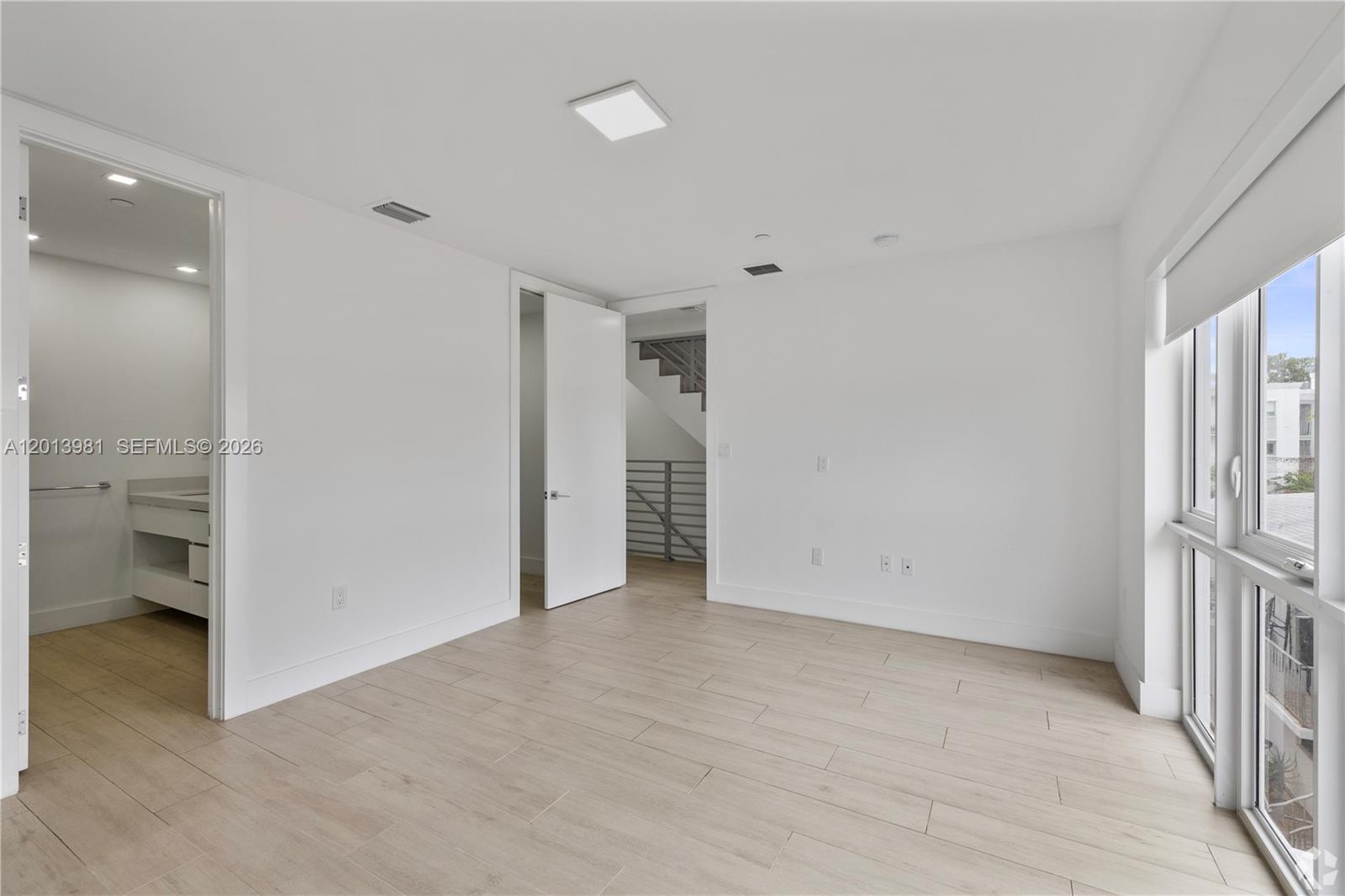 434 Southwest 10th Street, Unit A Miami, FL 33130 - Photo 11 of 23 an empty room with a bathroom and a sink