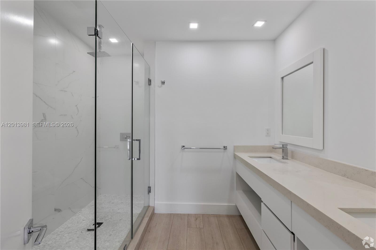 434 Southwest 10th Street, Unit A Miami, FL 33130 - Photo 13 of 23 a bathroom with a sink and a mirror