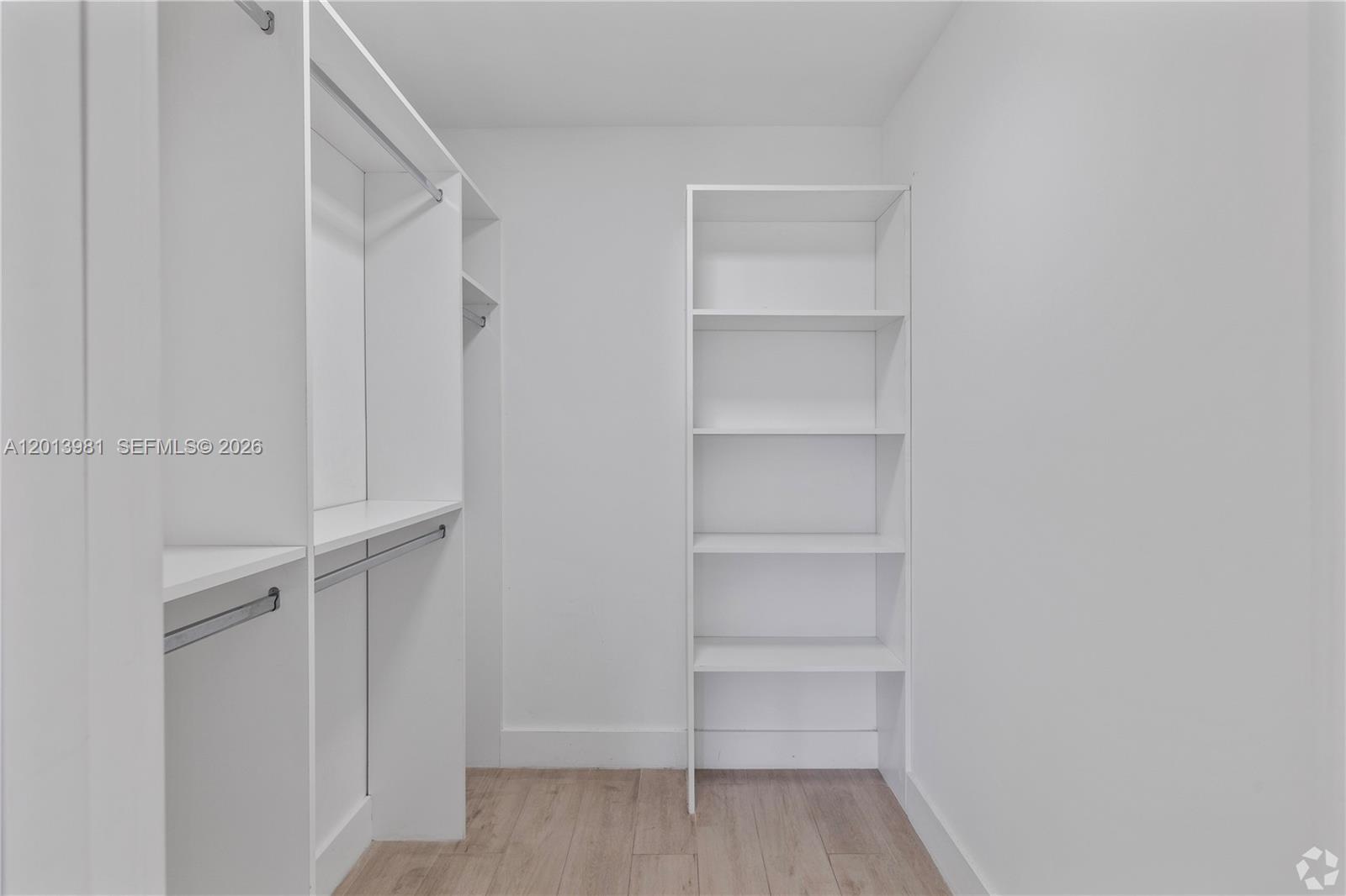 434 Southwest 10th Street, Unit A Miami, FL 33130 - Photo 14 of 23 a view of walk in closet with empty racks