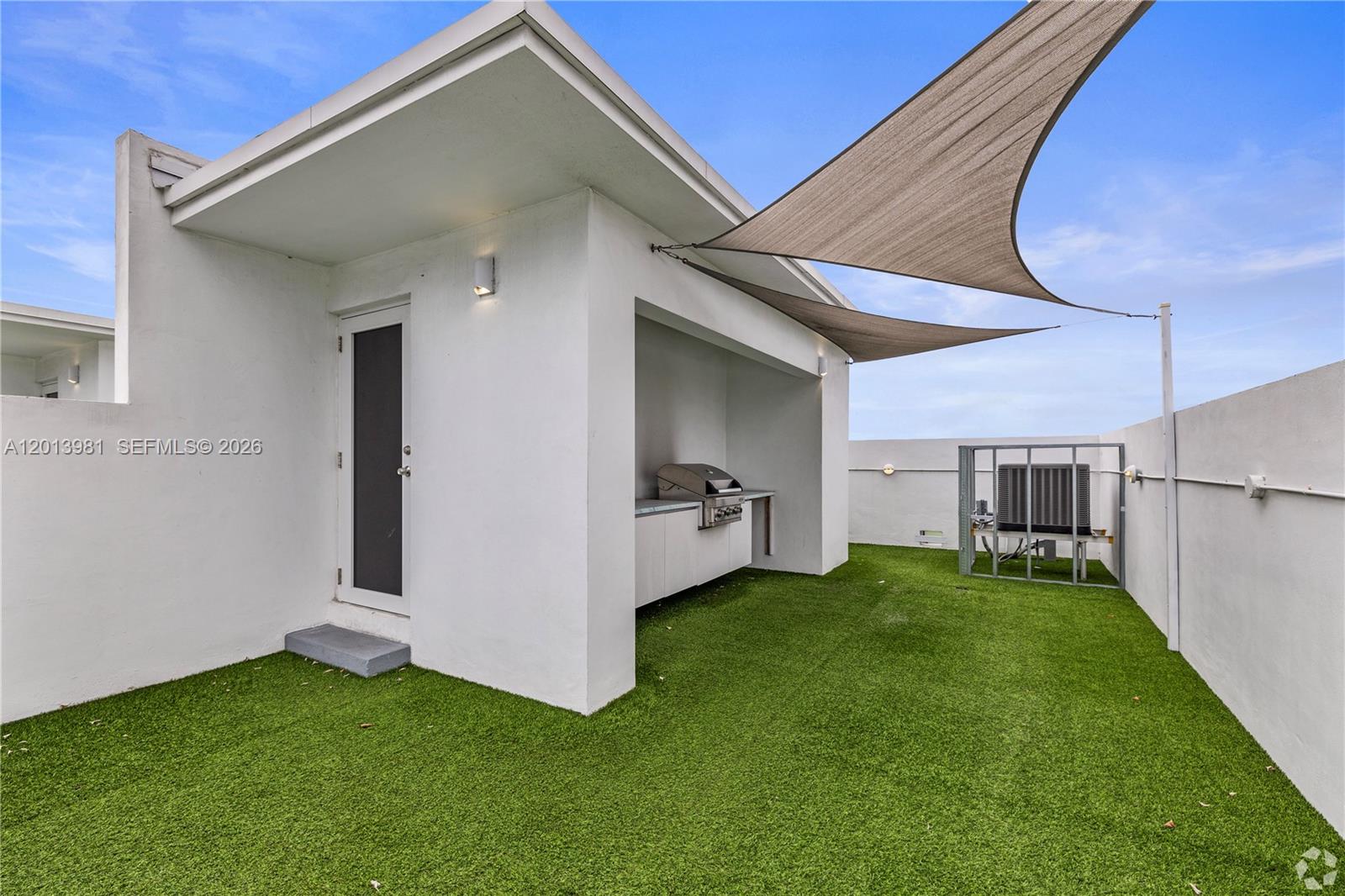 434 Southwest 10th Street, Unit A Miami, FL 33130 - Photo 18 of 23 a view of a backyard with plants and a backyard