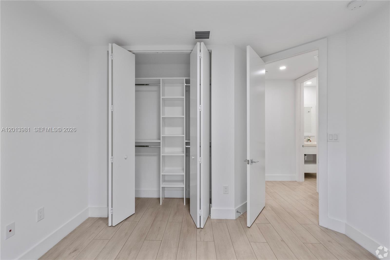 434 Southwest 10th Street, Unit A Miami, FL 33130 - Photo 7 of 23 a view of a hallway with wooden floor