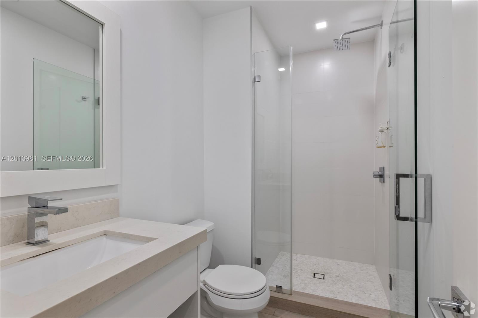 434 Southwest 10th Street, Unit A Miami, FL 33130 - Photo 9 of 23 a bathroom with a sink a toilet and shower