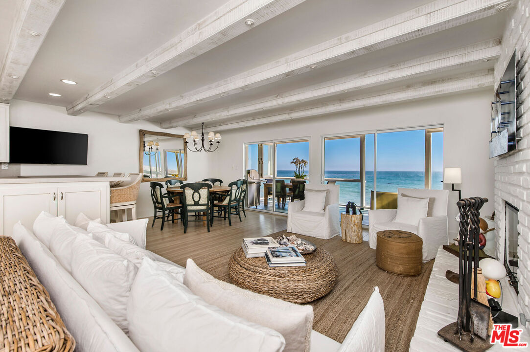 31640 Sea Level Drive Malibu, CA 90265 - Photo 1 of 41 a living room with furniture and a flat screen tv
