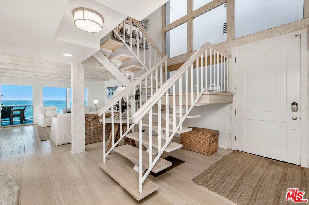 31640 Sea Level Drive Malibu, CA 90265 - Photo 11 of 41 a view of entryway and hall with wooden floor