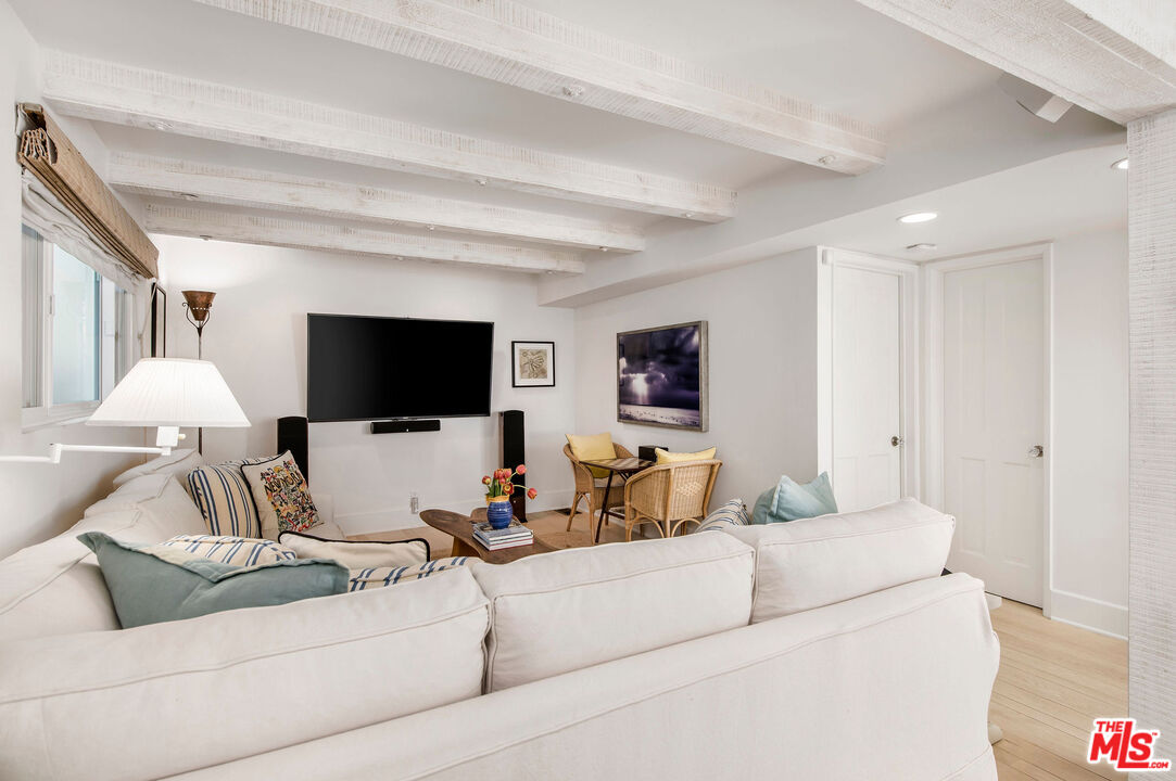 31640 Sea Level Drive Malibu, CA 90265 - Photo 12 of 41 a living room with furniture and a flat screen tv