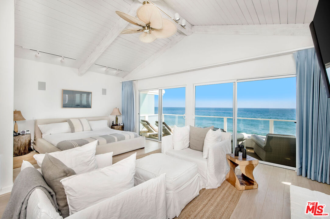 31640 Sea Level Drive Malibu, CA 90265 - Photo 15 of 41 a large bedroom with furniture and a large window