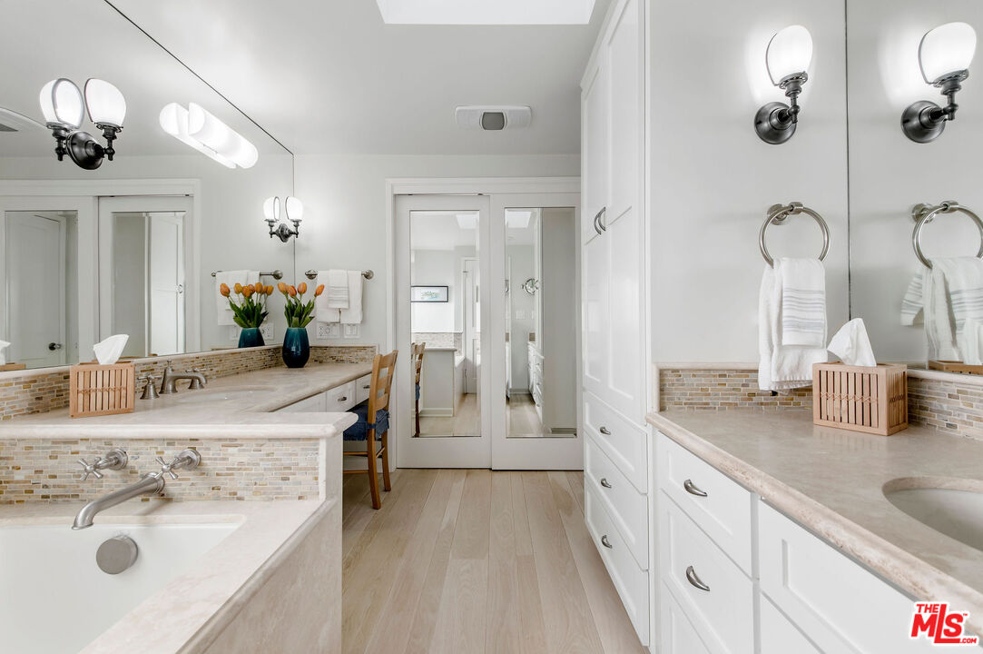 31640 Sea Level Drive Malibu, CA 90265 - Photo 22 of 41 a spacious bathroom with a double vanity sink mirror and