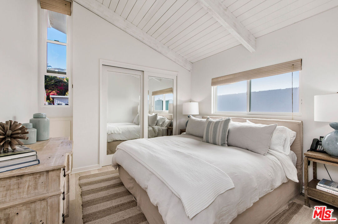 31640 Sea Level Drive Malibu, CA 90265 - Photo 25 of 41 a bedroom with a bed and a view of bedroom