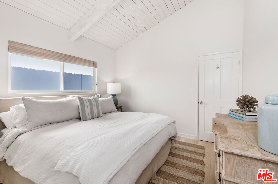 31640 Sea Level Drive Malibu, CA 90265 - Photo 26 of 41 a bedroom with a bed and a window